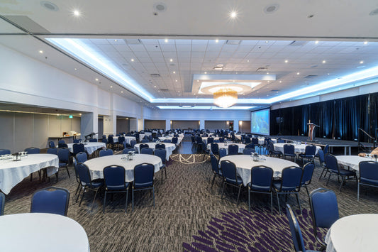 Banquet tables prepared for a corporate event in Edmonton